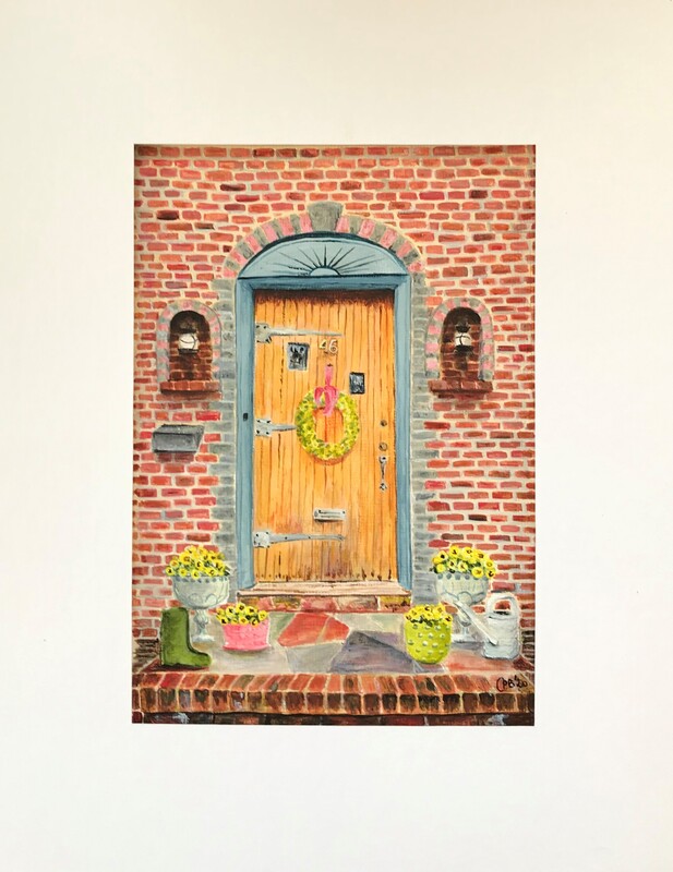 Focus on door with new wreath and small boots added on the front steps